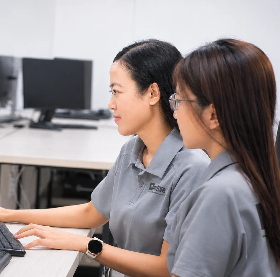 Engineering team collaborating around a product screen