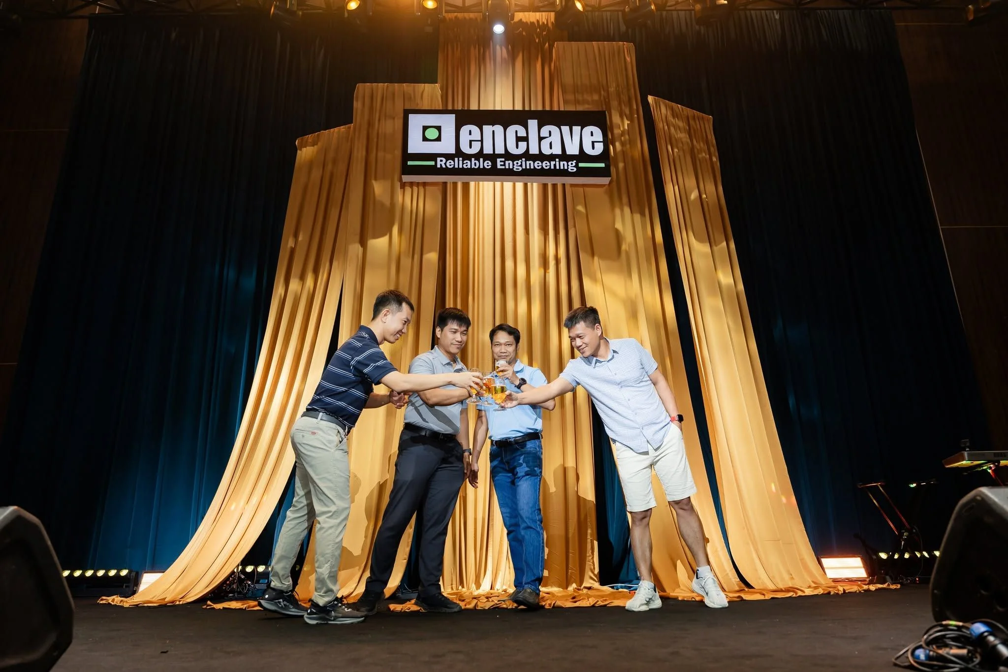 Enclave directors raising a toast during the company's 19th anniversary celebration.